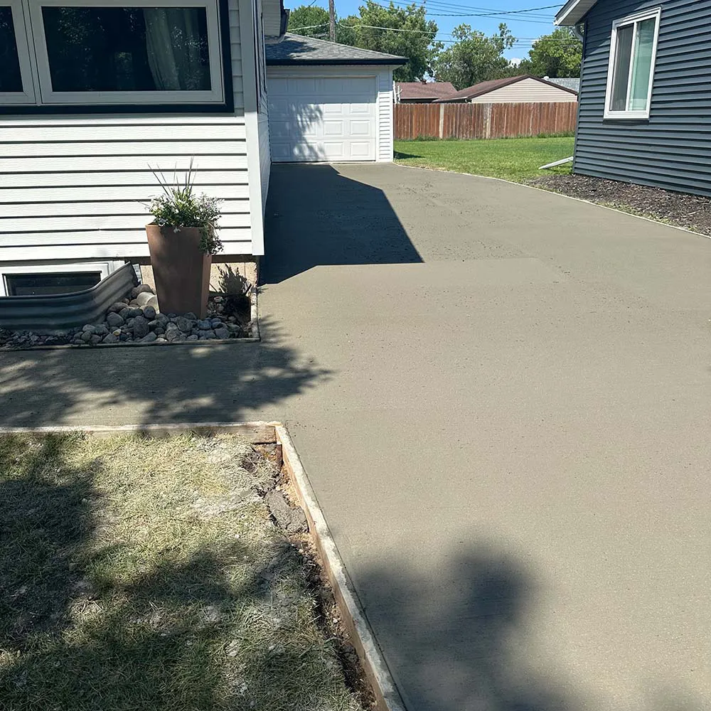 New residential driveway next to an older home